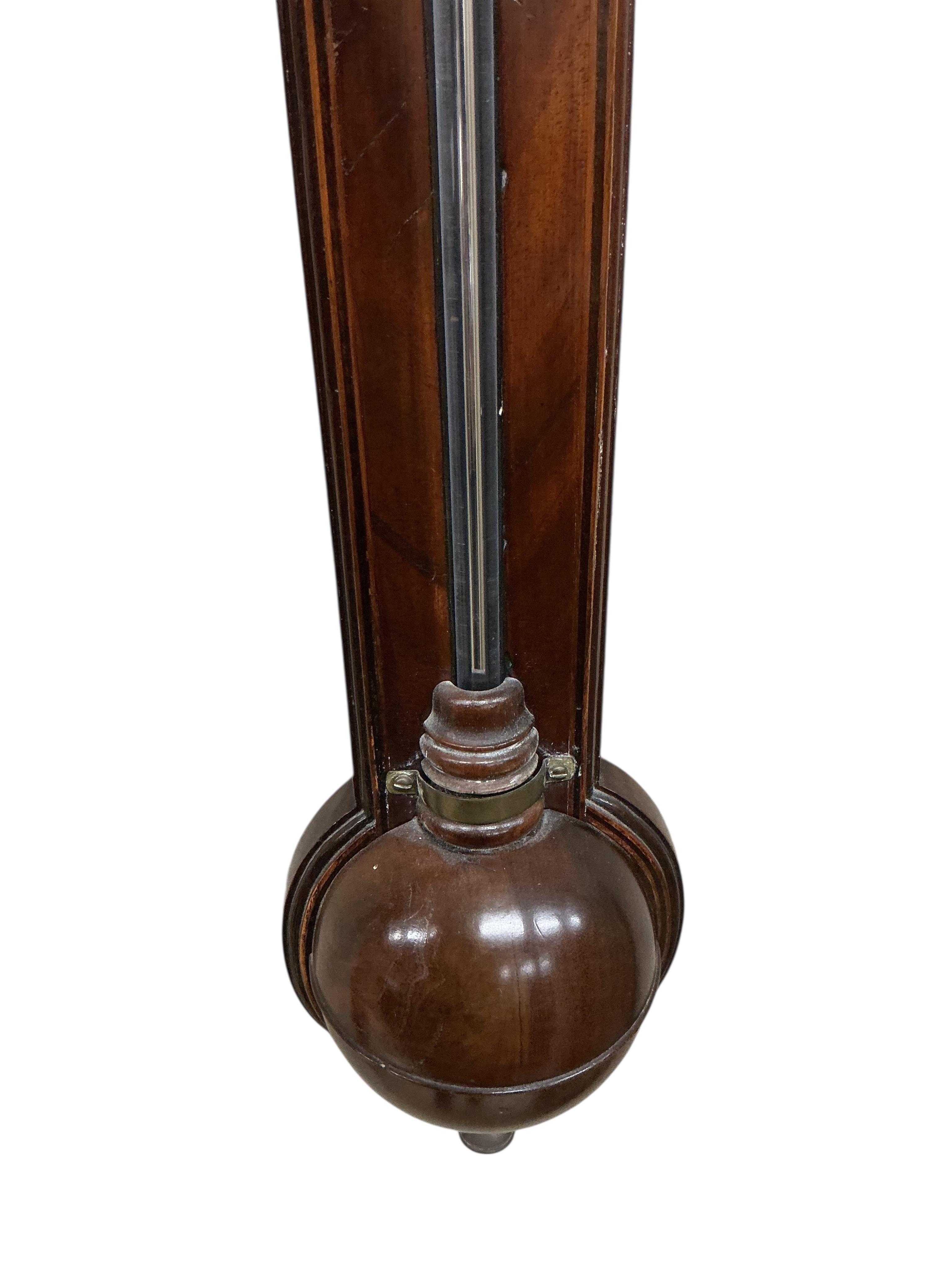 A George III mahogany stick barometer, silver dial marked Watkins, London, height 95cm